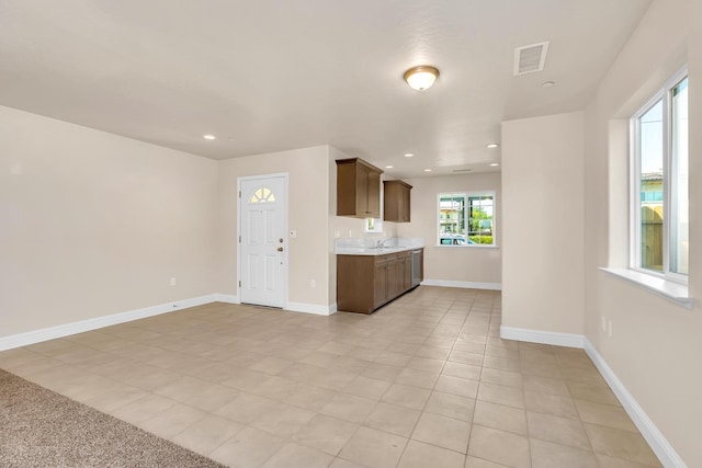 208 E Florence Ave, Fresno, CA 93706 - kitchen with light countertops, light tile patterned floors, visible vents, and recessed lighting