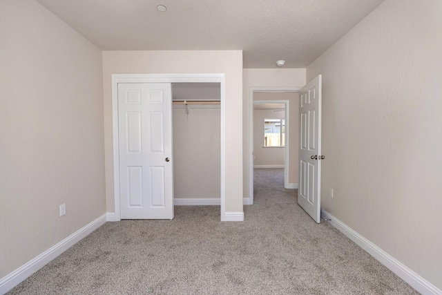 208 E Florence Ave, Fresno, CA 93706 - unfurnished bedroom with a closet, baseboards, and carpet floors