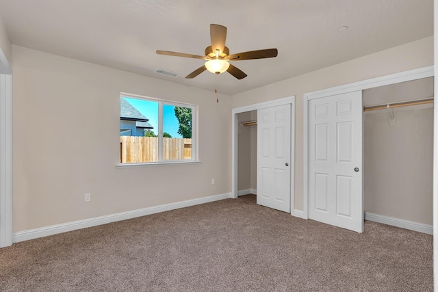 208 E Florence Ave, Fresno, CA 93706 - unfurnished bedroom featuring carpet, baseboards, visible vents, and two closets