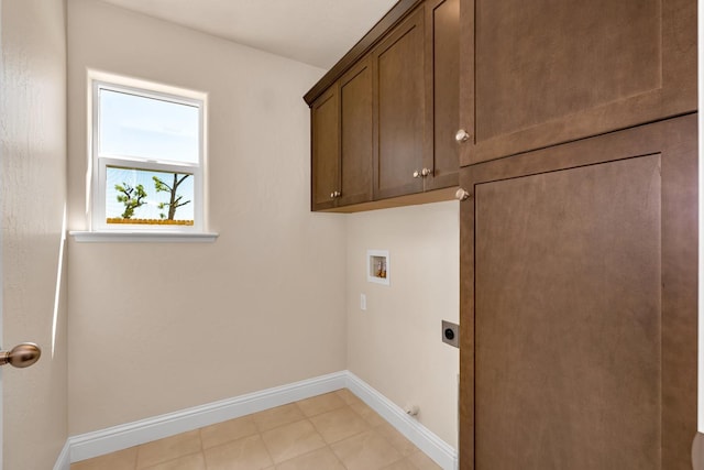 208 E Florence Ave, Fresno, CA 93706 - washroom featuring cabinet space, light tile patterned floors, electric dryer hookup, washer hookup, and baseboards