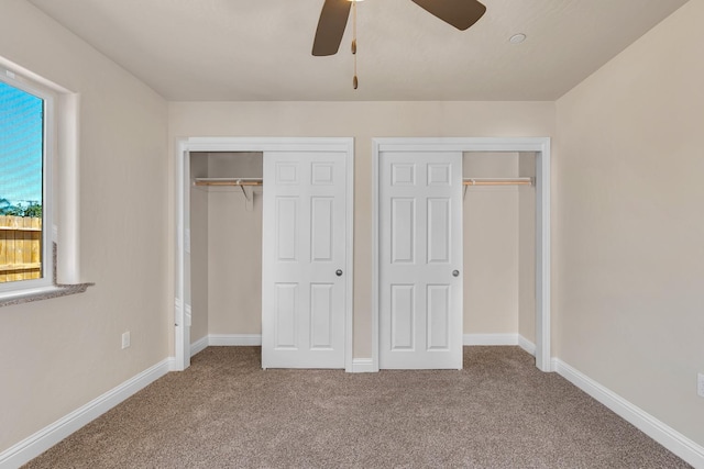 208 E Florence Ave, Fresno, CA 93706 - unfurnished bedroom featuring baseboards, multiple closets, a ceiling fan, and carpet