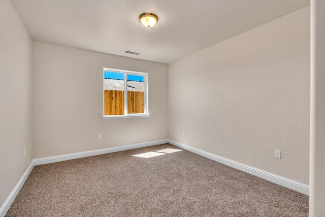 208 E Florence Ave, Fresno, CA 93706 - unfurnished room with carpet flooring, baseboards, and visible vents