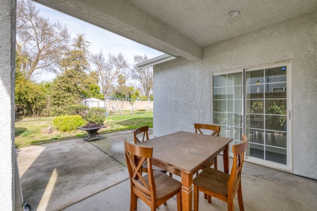 view of patio featuring a shed