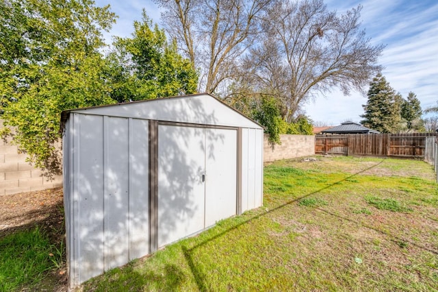 view of outdoor structure featuring a lawn