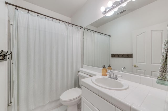 full bathroom with toilet, shower / bath combo with shower curtain, and vanity