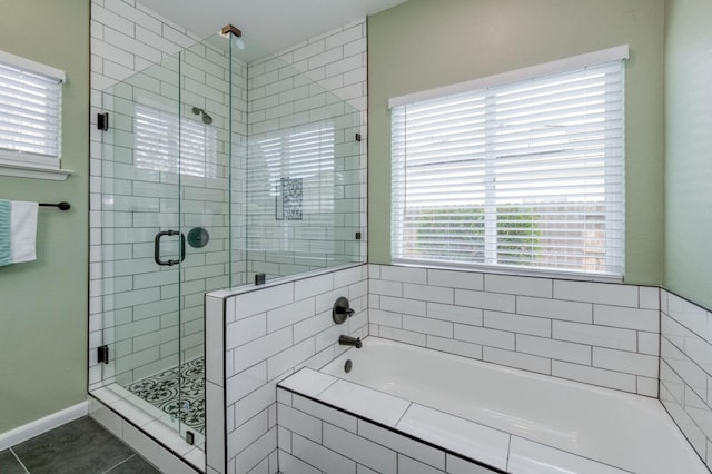 bathroom with tile patterned floors and independent shower and bath