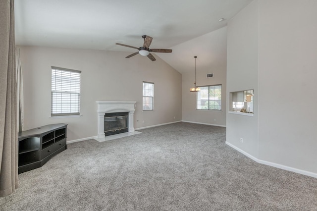 unfurnished living room featuring carpet, lofted ceiling, and ceiling fan