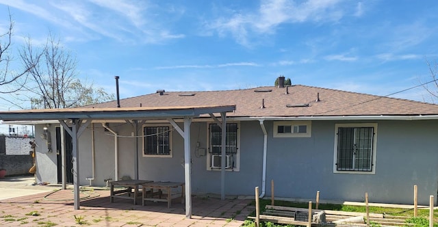 rear view of property featuring a patio