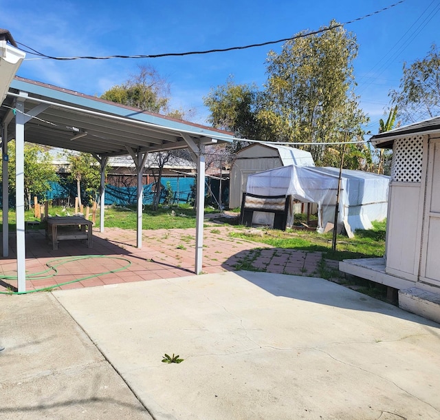 view of patio / terrace featuring a storage shed