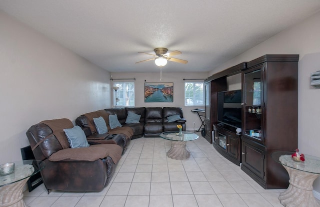 tiled living room featuring ceiling fan