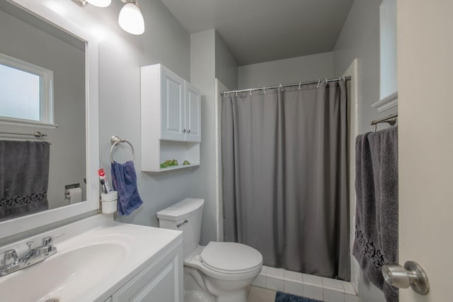 bathroom featuring toilet, curtained shower, and vanity