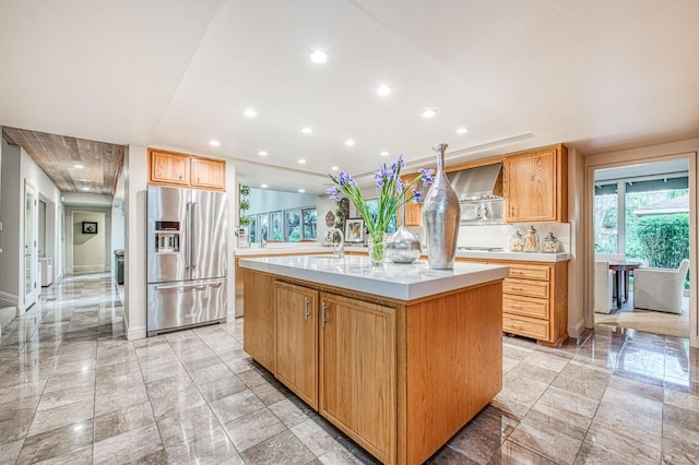 2352 W Loma Linda Ave, Fresno, CA 93711 - kitchen with stainless steel refrigerator with ice dispenser, light countertops, marble finish floor, and an island with sink
