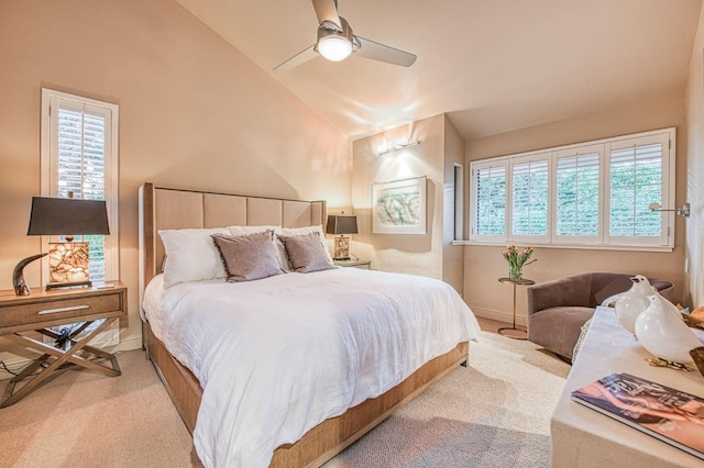 carpeted bedroom featuring vaulted ceiling and ceiling fan