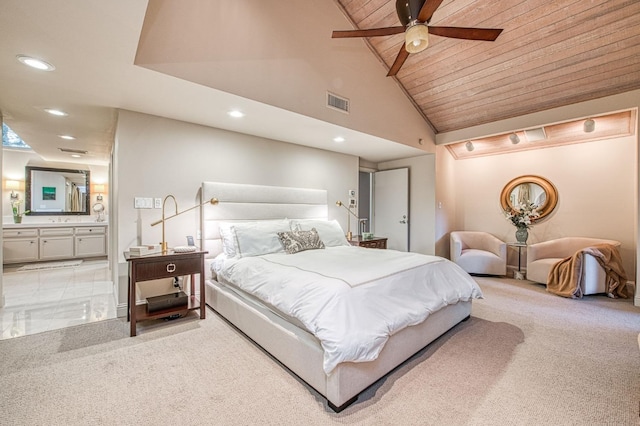 carpeted bedroom with high vaulted ceiling, wooden ceiling, ceiling fan, and ensuite bath