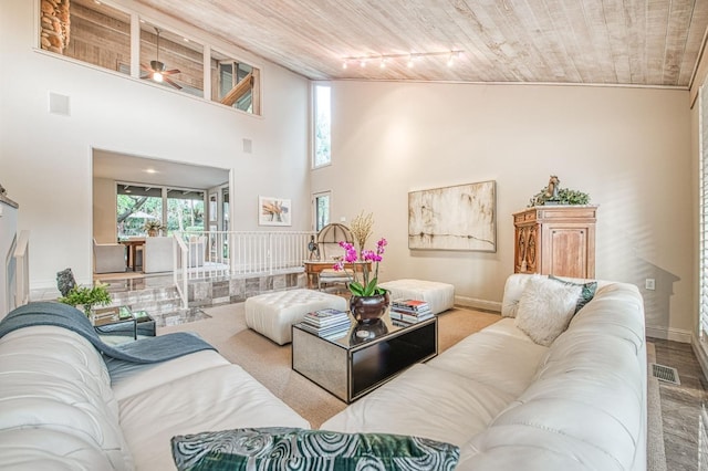 2352 W Loma Linda Ave, Fresno, CA 93711 - living area with wooden ceiling, baseboards, a high ceiling, and ceiling fan