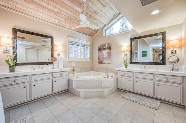 bathroom with lofted ceiling, tile patterned flooring, ceiling fan, and vanity