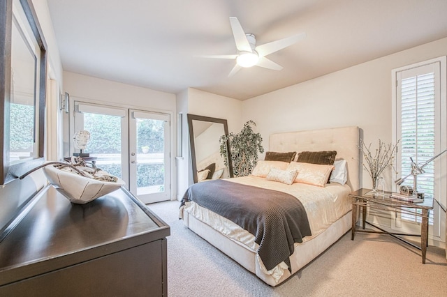 carpeted bedroom with ceiling fan, access to outside, and french doors