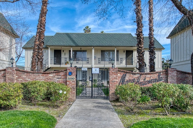 view of front of property with a balcony