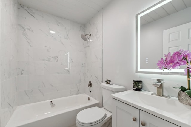 full bathroom with tiled shower / bath combo, toilet, and vanity