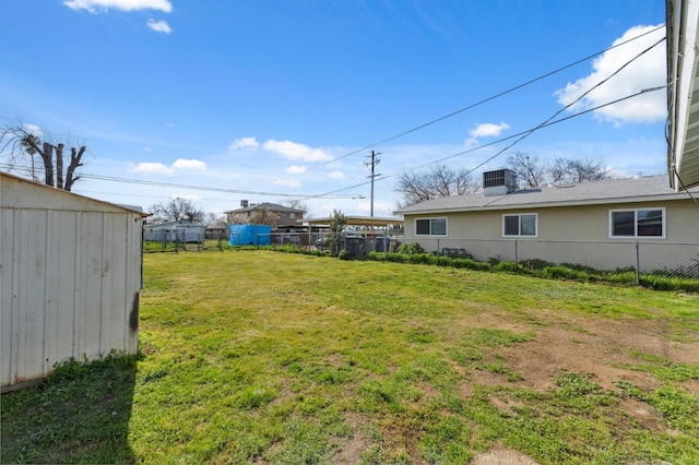 view of yard with cooling unit and fence