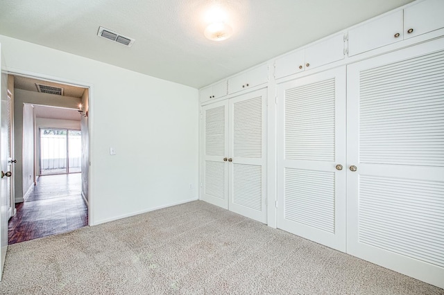 unfurnished bedroom featuring light colored carpet