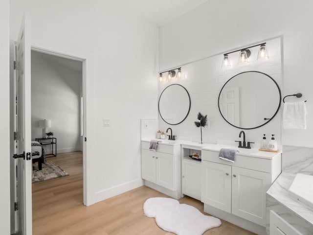 bathroom featuring wood-type flooring and vanity