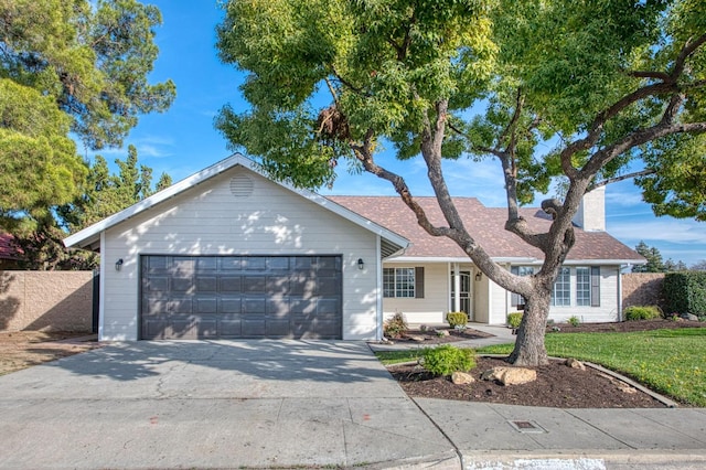 single story home featuring a garage