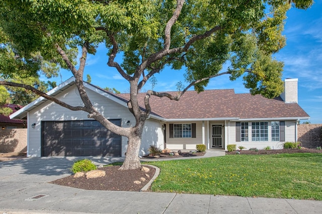 single story home with a front lawn and a garage