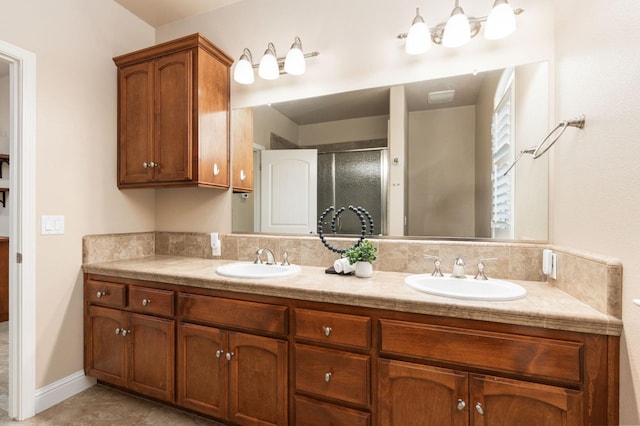 bathroom featuring vanity and a shower with door