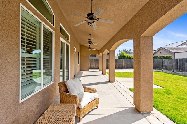 view of patio featuring ceiling fan