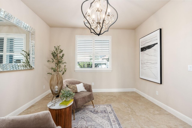 living area featuring an inviting chandelier