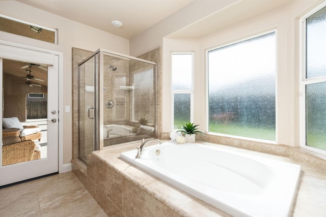 bathroom with shower with separate bathtub and tile patterned floors