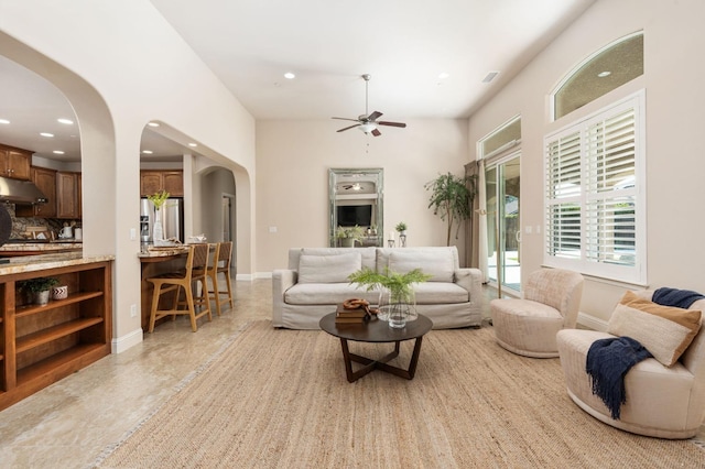 living room with ceiling fan