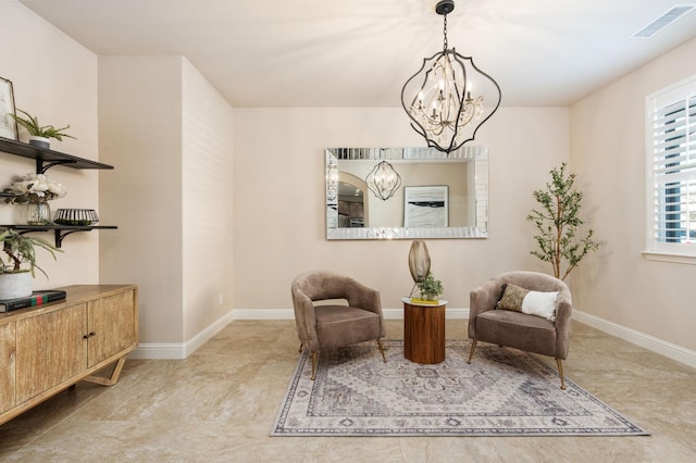 living area with a chandelier