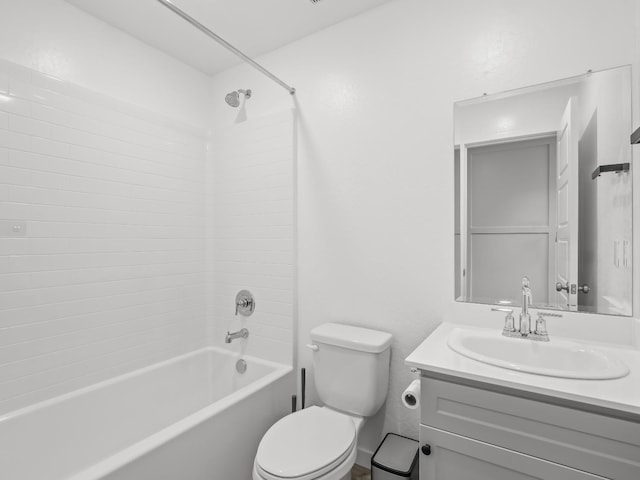 full bathroom featuring toilet, vanity, and tub / shower combination