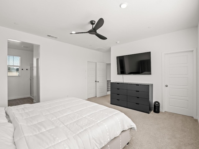 carpeted bedroom featuring ceiling fan