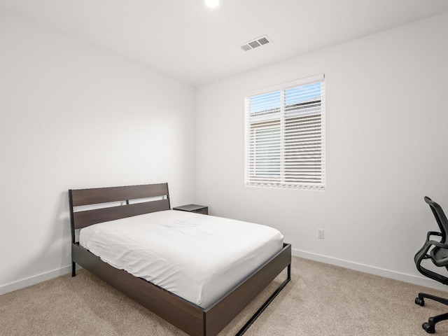 bedroom with light carpet