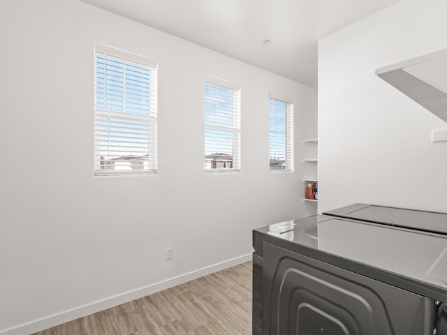 interior space featuring washer / clothes dryer and light hardwood / wood-style floors