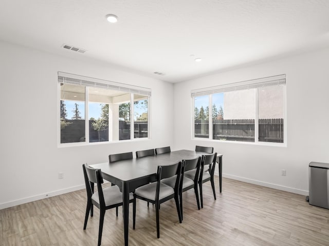 dining space featuring light hardwood / wood-style floors