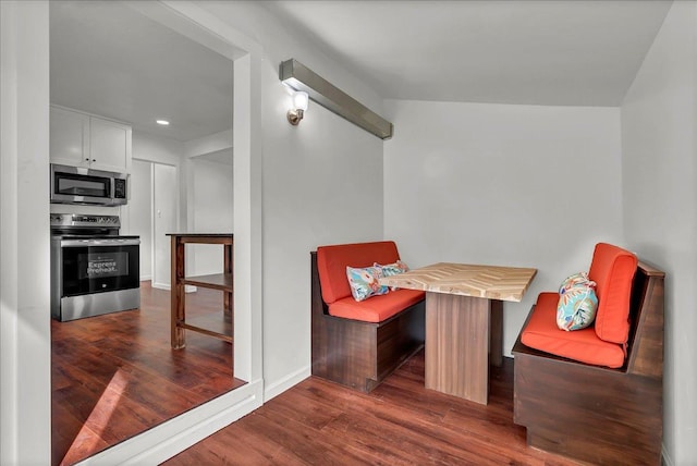 sitting room with dark hardwood / wood-style flooring