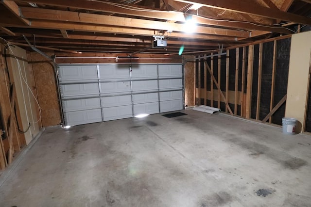 garage featuring a garage door opener