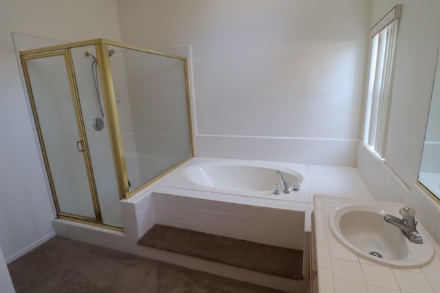 bathroom with vanity, plus walk in shower, and a healthy amount of sunlight