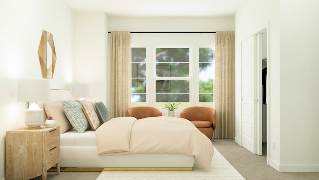 bedroom with light colored carpet and baseboards