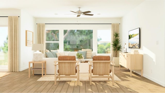 sitting room featuring ceiling fan and light hardwood / wood-style floors