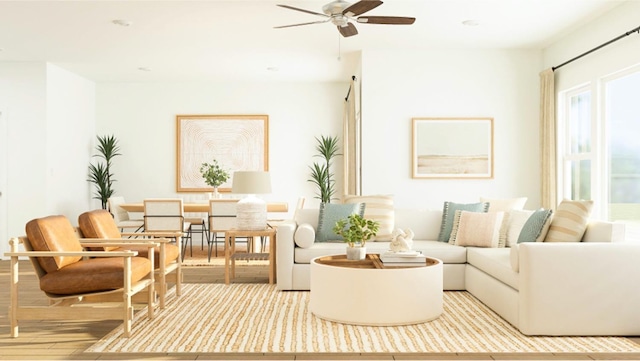 living area featuring wood finished floors and a ceiling fan
