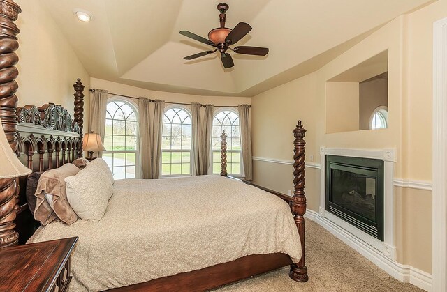 14505 Blue Drake Ln, Prather, CA 93651 - bedroom featuring a tray ceiling, a glass covered fireplace, carpet floors, and ceiling fan