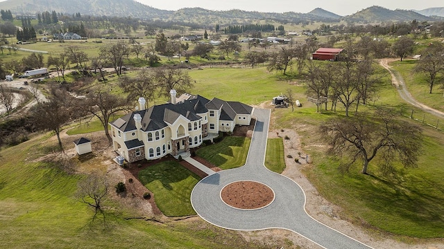 drone / aerial view featuring a mountain view