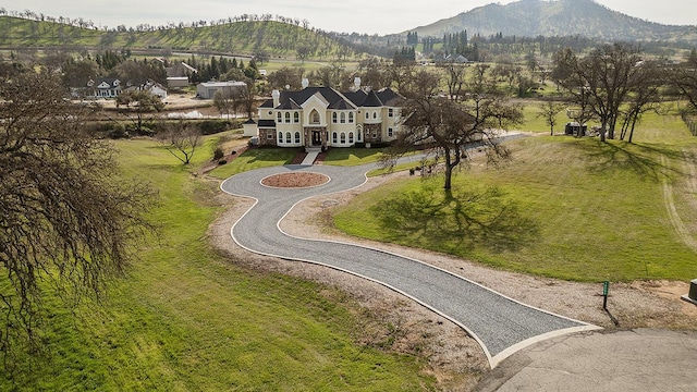 birds eye view of property featuring a mountain view