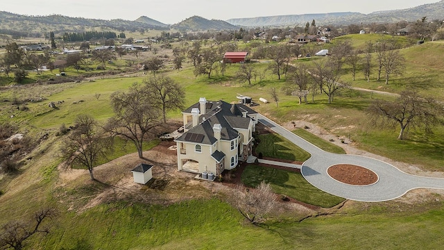 drone / aerial view featuring a mountain view