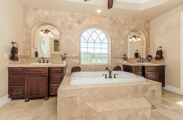 14505 Blue Drake Ln, Prather, CA 93651 - bathroom featuring two vanities, a garden tub, and ceiling fan